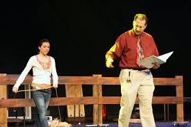 Co-director Ben Krothe gives stage directions to Sarah Fi…