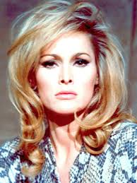 Recognize this face? She's starred in chilling horror films and period  dramas, known for her unique look and intense performances. Any guesses who  this childhood photo belongs to? Comment below! #Whoisthischild