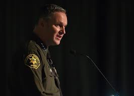 Don Barnes gives his speech after receiving his new badge as Orange  County's new sheriff. Photo by Steven Georges/Behind the Badge The article  also features a podcast interview with Orange County Sheriff