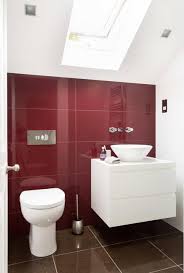 In a bathroom with a high ceiling and good natural lighting, a deep, inky wall color will look elegant. Neutral Colors And Vibrant Accents Small Bathroom Remodeling Ideas