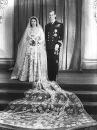 Norman hartnell was chosen to design princess elizabeth's ivory satin wedding dress which was the rich dress of duchesse satin contrasts with the white seed pearls, imported from america, silver thread, sparkling crystal and transparent applique. The Queen S Wedding Gown Was Inspired By A Painting How World War Ii Affected Queen Elizabeth Ii And Prince Philip S Wedding Popsugar Celebrity Photo 3
