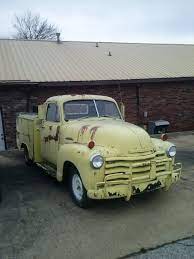 Old Chevy Pickup With A Utility Bed Looks Like Someone Once Painted It With A Brush Found In Fayetteville Arkansas Old Chevy Pickups Work Truck Chevy Pickups