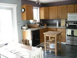 4 Steps To Choose Kitchen Paint Colors With Oak Cabinets Interior Decorating Colors Grey Kitchen Walls Simple Kitchen Design Brown Cabinets