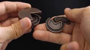 The asymmetrical design will mesmerise you and bewilder your memory. Cake Hanayama Cast Metal Brain Teaser Puzzle Level 4 Gear For Life