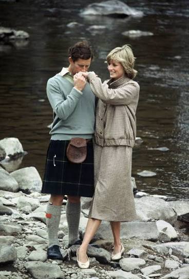 Prince Charles and Princess Diana pose for a photo on the banks of the  river Dee in the grounds of Balmoral Castle during their honeymoon in  Balmoral, Scotland I August 19, 1981