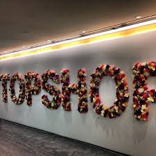 Love That Topshop Hk Is Already Blooming Such A Pretty Sign At Our Opening Party Topshop Flowers Hongkong S Hoarding Design Signage Wayfinding Signage
