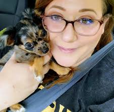 My baby girl, Miss Winnie, basking in the crisp morning air. Usually she  trying to eat this bed so I had to capture the moment for posterity. Lol