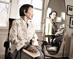 Image of person looking at their reflection in a mirror