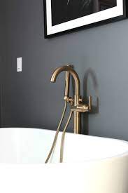 Wovier brushed gold bathroom sink faucet with supply hose,unique design single handle . Delta Champagne Bronze Faucets And Fixtures In The Master Bathroom