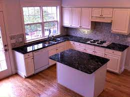 Backsplash for black granite countertops and white cabinets. Let Legacy Granite Update Your Kitchen With New Black Forest Granite Countertops Dark Granite Countertops Granite Countertops Kitchen