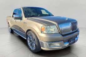 Image result for Dark Toreador Red 2006 Lincoln