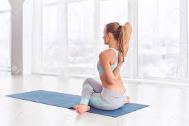 Beautiful Young Woman Practices Yoga Asana Gomukhasana Cow Stock Photo Picture And Royalty Free Image Image 94295766