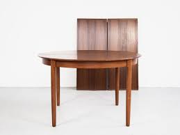 Midcentury modern danish dining round table in teak with two extension leaves with rounded and tapered legs. Midcentury Danish Round Dining Table In Teak With 2 Extensions 1960s Mobelfabrik