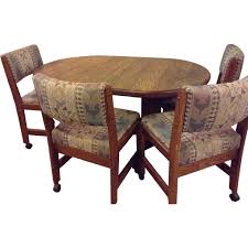 Casual dining cushion swivel and tilt rolling kitchen. Wooden Dining Table W 4 Rolling Chairs Aptdeco