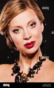 Woman wearing diamond necklace hi-res stock photography and images