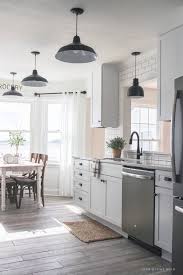 This brownish grey colour on the kitchen cabinet is the best choice to combine with the wood around it. Farmhouse Kitchen Makeover Reveal Love Grows Wild