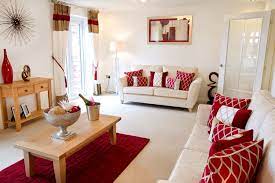 Red Hues Complement The Welcoming Cream Interior Of This Living Room Red Living Room Decor Cream Living Room Decor Living Room Red
