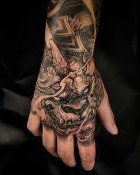 Black And Grey Foo Dog Hand Tattoo Pin By Paul Ole On Foo Dog Hand Tattoos For Guys Japanese Hand Tattoos Hand Tattoos