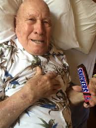 My dear old Dad (Yellow rain coat), clutching Aaron then and looking down  from heaven now. Go Pack Go!