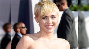 Miley Cyrus poses naked with bunch of stuffed animals - The Economic Times