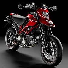 Tor is presented with a special bike before the launch starts. Ducati Hypermotard 1100 Evo