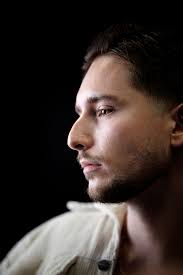 A Man Looking Over His Shoulder · Free Stock Photo