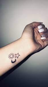 Small Tattoo Idea Tiny Wrist Tattoos Sun And Stars Tattoo Moon Sun Star Tattoo