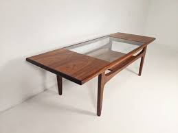 Inspired by the beauty of natural root form, this organic teak coffee table is handcrafted from one piece of salvaged teak root. Mid Century Modern Surfboard Teak Glass Coffee Table By Victor Wilkins Fresco Collection For G Plan Epoch