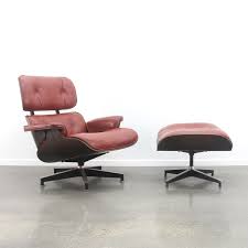 The upholstery is curated and statement. Eames Lounge Chair Ottoman In Red Leather Dark Rosewood 1960s 82171