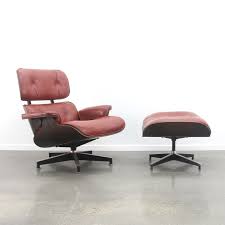 The upholstery is curated and statement. Eames Lounge Chair Ottoman In Red Leather Dark Rosewood 1960s 82171