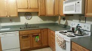 We are a family owned business that takes great pride in our work…. Original Kitchen Oak Cabinets Green Laminate Counter Tops White Appliances Laminate Countertops Laminate Counter Oak Cabinets