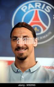 Zlatan Ibrahimovic of Paris Saint Germain, center, tries to pass between  Guingamp's Lionel Mathis, left, and Moustapha Diallo, right, during their  French League One soccer match in Paris, Saturday, Aug. 31, 2013. (