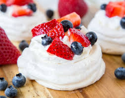 Meringues can be dipped in chocolate. Mini Pavlova Recipe Dinners Dishes And Desserts