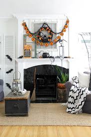 Black White And Orange Halloween Decorating In Our Living Room The Wicker House Halloween Living Room Halloween Fireplace Creepy Halloween Decorations