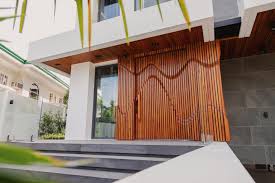 An eye catching and innovative main door made of natural Narra wood is what  distinguishes a Draco home from all the other modern homes out there. This  Narra door has evolved from