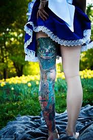 A watercolour design that involves a book. Alice In Wonderland Tattoo Model Hope Avdeev Photographer Eugene Dredos Tattoo Artists Ivan Ches Wonderland Tattoo Alice And Wonderland Tattoos Leg Tattoos