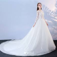 Beautiful ruffled ball gown wedding dress with modest lace long sleeves. Affordable White Pierced Wedding Dresses 2017 Ball Gown Scoop Neck Long Sleeve Backless Appliques Lace Chapel Train