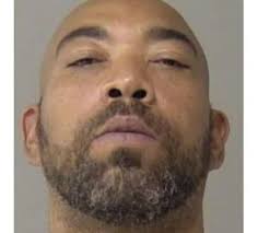 Decatur, Illinois manhunt for armed and dangerous man. Do not approach if  you see him. Latonian Johnson, 50 years old, is accused of fatally stabbing  38-year-old mother Dawnette Sigmon