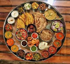 This Enormous Thali Includes More Than 25 Dishes Apart From The Two Drinks That Are Indian Food Photography Indian Food Recipes Indian Food Recipes Vegetarian