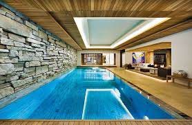 If you want to go all the way with your enclosure and make it a part of your home, check out our indoor swimming pool guides for tons of details on the costs. Best 46 Indoor Swimming Pool Design Ideas For Your Home Piscine Interieure Piscine Interieure Grange Piscines Interieur