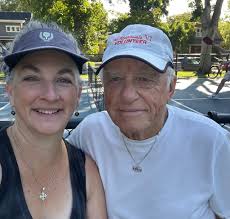 The Pignato family of THREE generations, often enjoy evenings of pickleball  together at Theobold Courts. Jeff, Jim, Carrie, and Lydia enjoy the  beautiful evening as Lolly watches. Elisabeth and Jacob, attend college