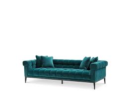 The white sofa can function as a blank canvas to decorate with lots of pretty seaside colors all around it. Eichholtz Sofa Aurelio Savona Sea Green Wilhelmina Designs