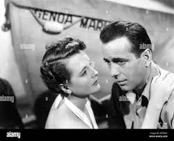 MARY ASTOR and HUMPHREY BOGART posed publicity portrait for ACROSS THE  PACIFIC 1942 directors JOHN HUSTON and VINCENT SHERMAN Warner Bros Stock  Photo