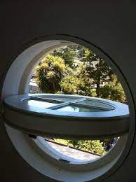 Oval windows add a stylish statement to any home design. Marvin Aluminum Clad Pivot Window Ot Glass Windows Exterior Window Architecture House Outside Design
