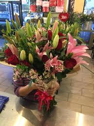 Hours may change under current circumstances Custom Rose And Lily Wrap In Los Angeles Ca American Flowers