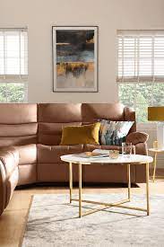 05 a stylish brown leather sofa with yellow decor