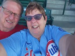 Red Wings game tonight! Had to wear my latest Cubbies jersey in the baby  blues. Michael Busch hit 3 homers for Chicago today! Sitting up kind of  high tonight. Packed house tonight.