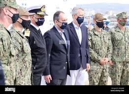 PIRAEUS, Greece (April 28, 2021) Lt. Cmdr. Steve Hulse, Commanding Officer  of USCGC Charles Moulthrope (WPC 1141), receives a plaque from the Hellenic  Coast Guard Commandant, Vice Adm. Theodoros Kliaris. Charles Moulthrope