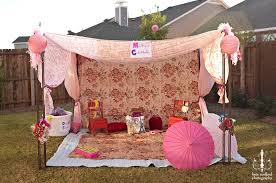 Incredible playhouse structure that is two playhouses connected by bridge and includes a slide. 8 Easy Affordable Kid Friendly Backyard Ideas Coupons Com