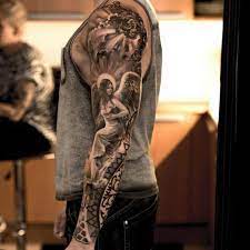 Guardian angel tattoo classic half sleeve. The Internet S Top 10 Angel Sleeve Tattoos